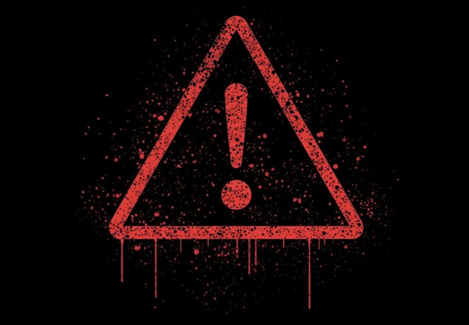 赤い警告マーク(感嘆符)が描かれた画像。注意や危険を示すイメージ。
