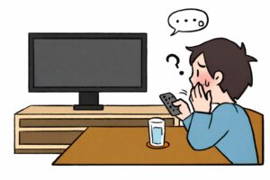 テレビが映らず、リモコンを手に困った表情で画面を見つめている人物が、テーブル越しにテレビ台と電源の入っていないテレビに向かって座っているイラスト。